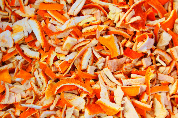 Finely chopped dry tangerine peel. Close-up. Background. Texture. stock photo