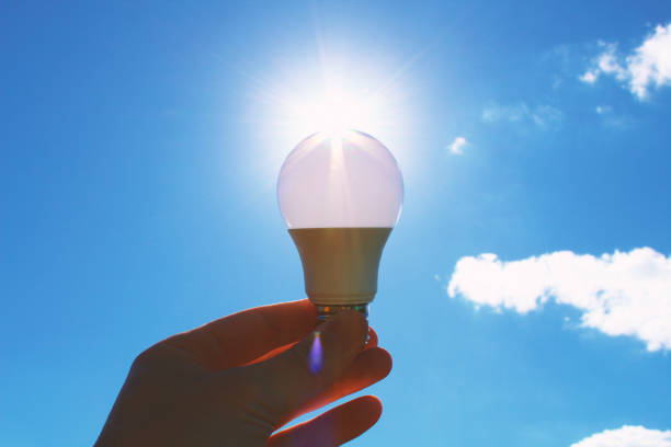 istock Energy saving lamp in hand. Close-up. Background. Texture. 1374630811