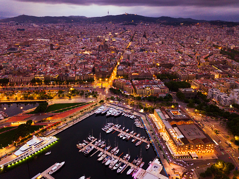 Night aerial  view from drones of old port in Barcelona and gothic quarter