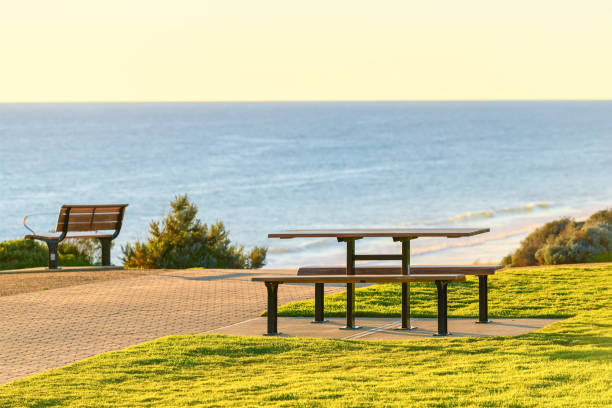 istock Picnic table at Maslin Beach sea shore at sunset 1374639968