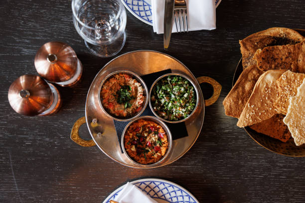 istock Salads with various ingredients, served on restaurant table in traditional copper bowls 1374641629