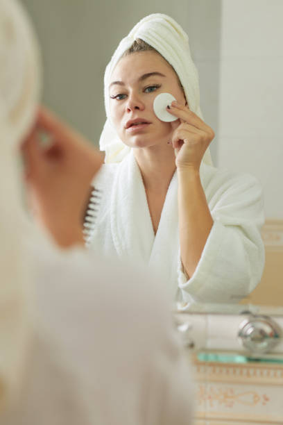 istock Woman Applying Face Toner 1374647229