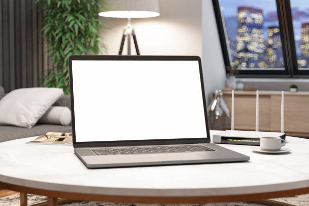 istock Blank Screen Laptop in Living Room with Coffee 1374648888