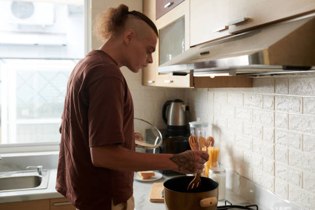 istock Man Cooking Pasta for Lunch 1374652216