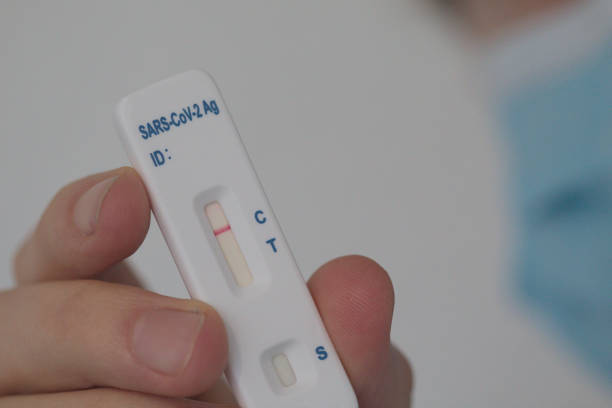 istock Self test covid sars-cov-2 negative in a hand (it's negative) 1374656431