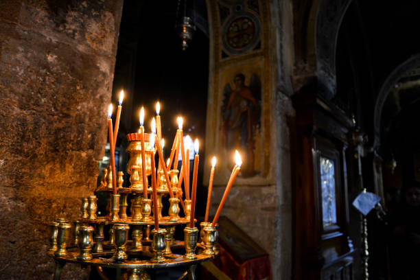 Burning candles in Christian church. Selective focus on candles