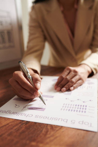 istock Businesswoman Correcting Infographics 1374663627