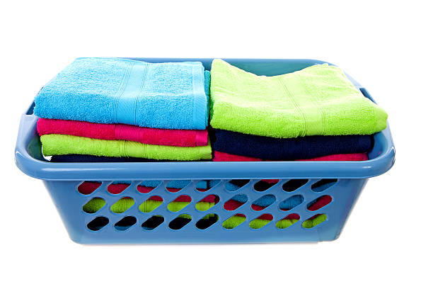 istock Laundry basket filled with colorful towels 137467153