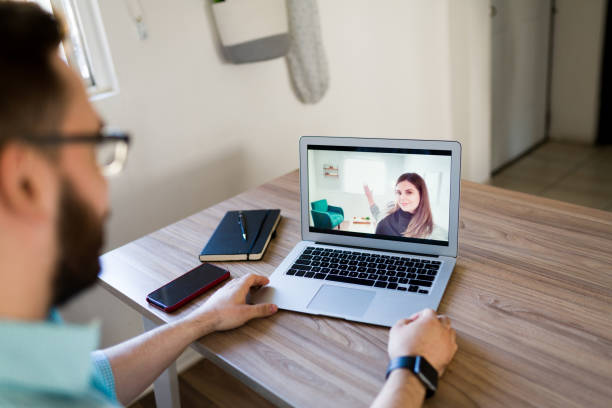 istock Virtual real estate agent showing a house 1374679976
