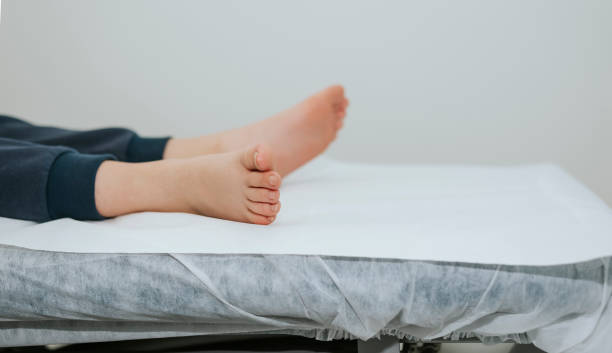 Plan of a child's feet on a physiotherapy table stock photo