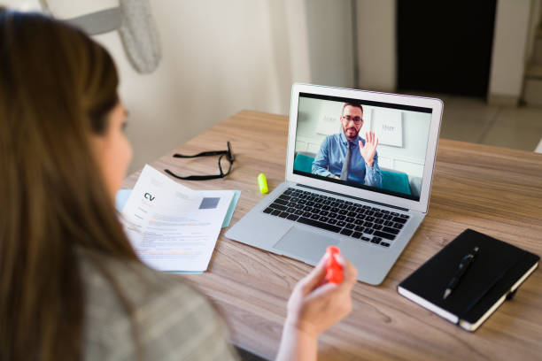 istock Man having an online meeting with human resources 1374686317