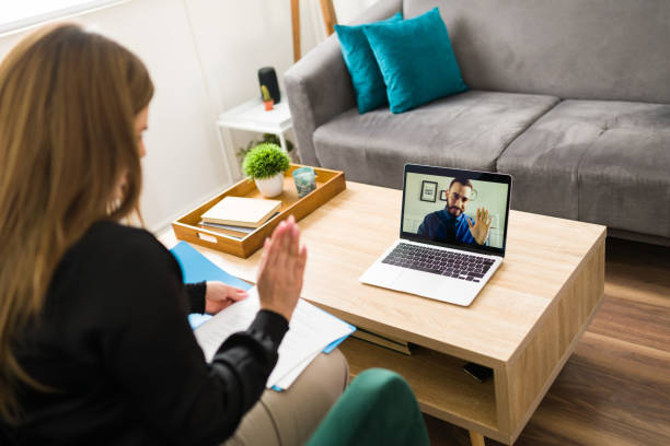 istock Professional woman speaking with a virtual attorney 1374687385