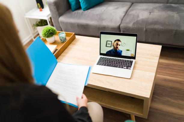 istock Attorney with a business contract on a teleconference 1374687395