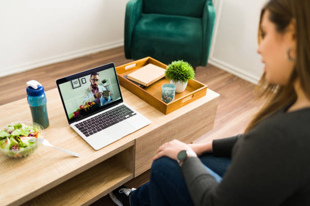 istock Woman on a teleconference with a nutritionist 1374687973