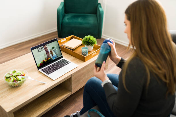 istock Young woman on a video call with a nutritionist 1374688559