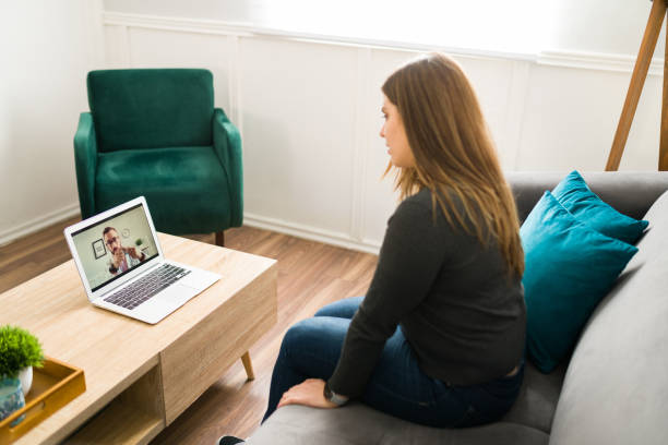 istock Rear view of a patient talking online with a physician 1374691281