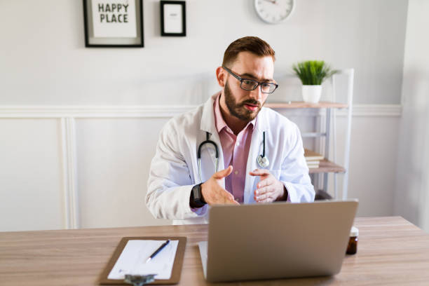 istock Male physician speaking with a patient on a meeting 1374691523