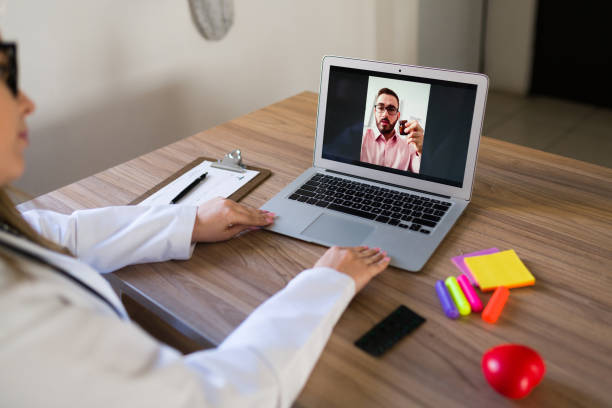 istock Rear view of a patient and a virtual doctor 1374691833