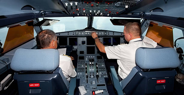 istock Pilots in the cockpit during a commercial flight 137469332