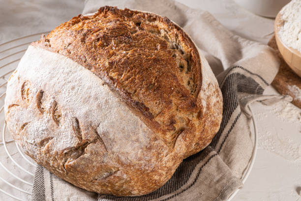 istock Freshly artisan baked wheat and rye bread, country bread. Simple bread for breakfast 1374705522
