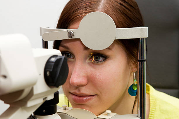 istock Young girl at the optometrist checking her vision 137470599