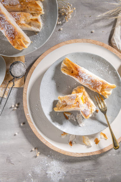istock Typical portuguese sweets Pasteis de Vouzela served on countertop. Filo pastry with egg cream filling 1374706732