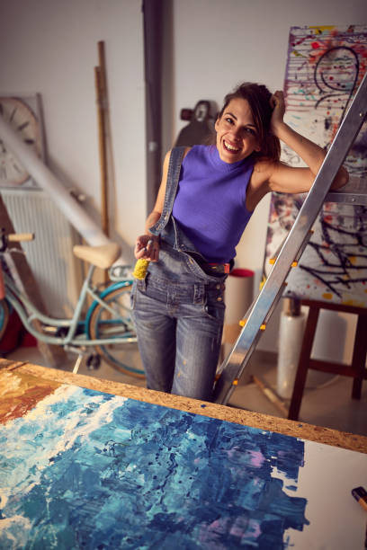 istock Female drawing on a canvas in art studio.Creative inspired mood. 1374725668