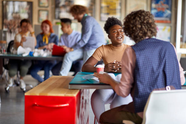 istock Young motivated employees consulting together 1374731844