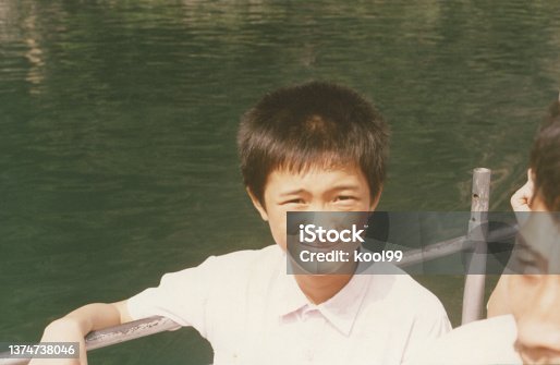 istock 1990s Chinese Llittle Boy Old Photo of Real Life 1374738046