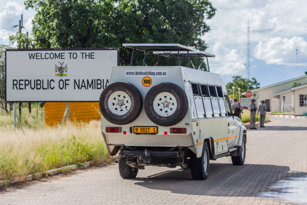A safari vehicle crossing the border between Botswana and Namibia stock photo