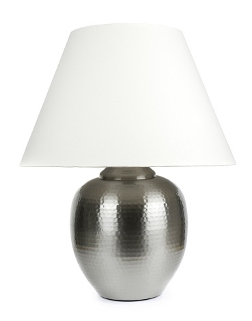 Large metal table lamp with white lampshade isolated