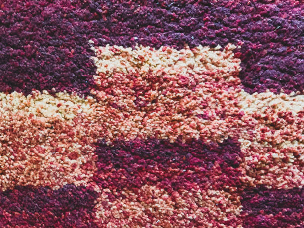 istock A texture of a red, orange and yellow fabric. 1374765494
