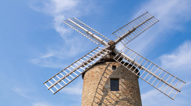 istock Low angle shot of a windmill under the cloudy sky 1374779953
