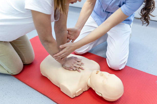 istock Nursing students are learning how to rescue the patient in emergency. CPR training with CPR doll. Closed-up. Soft focus. 1374781029