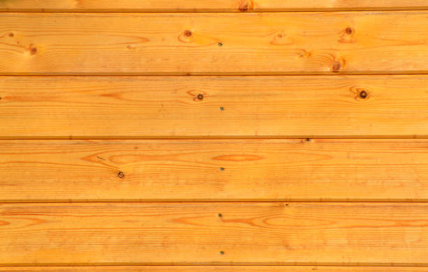 istock Brown wood plank wall. Old and beautiful background. Natural pattern for design. Grunge background. Peeling paint on an old wooden wall. Rustic style wallpaper. Timber texture 1374783743