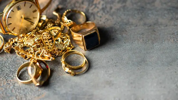 Photo of Old and broken jewelry, vintage watches on dark background. Sell  gold  for cash concept.