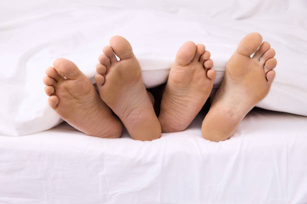 istock Real Feet lesbian couple together 1374787916