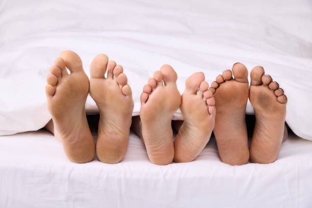 istock Real feet of three people 1374787988