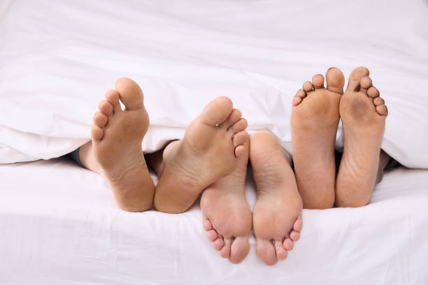 istock Real feet of three people 1374787991