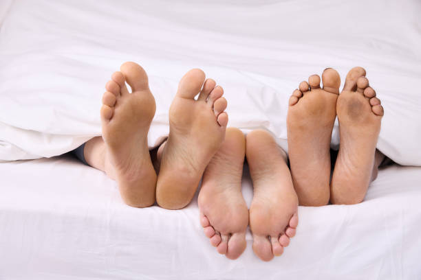 istock Real feet of a triangle relationship 1374788013