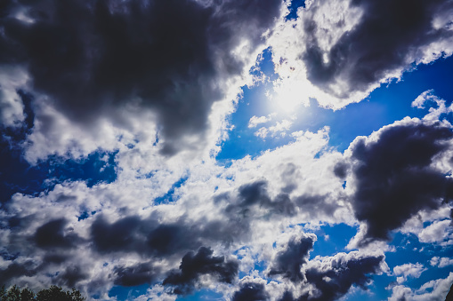 Natural cloud sky background, dramatic cloud against sunlight on blue sky