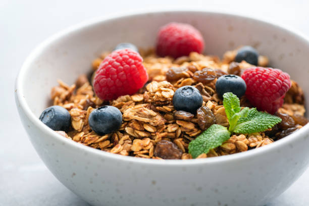 istock Bowl of crunchy granola with berries 1374798122