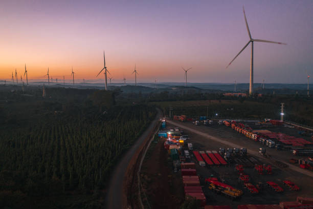 Wind turbine farm in sunrise stock photo