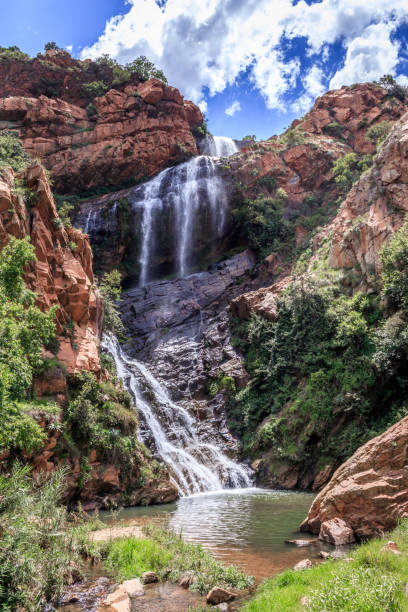 View of a waterfall and river in a mountainous area in Walter Sisulu National botanical gardens, Johannesburg, South Africa stock photo