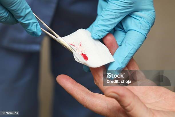 Nurse Is Changing Bandage To A Wounded Patients Finger Stock Photo - Download Image Now