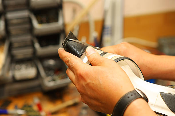 istock Shoemaker is repairing old shoe 137484843