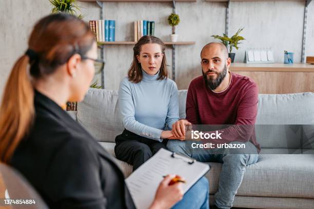 Young Couple Going To Marriage Counseling Stock Photo - Download Image Now - Psychotherapy, Couple - Relationship, Mental Health Professional