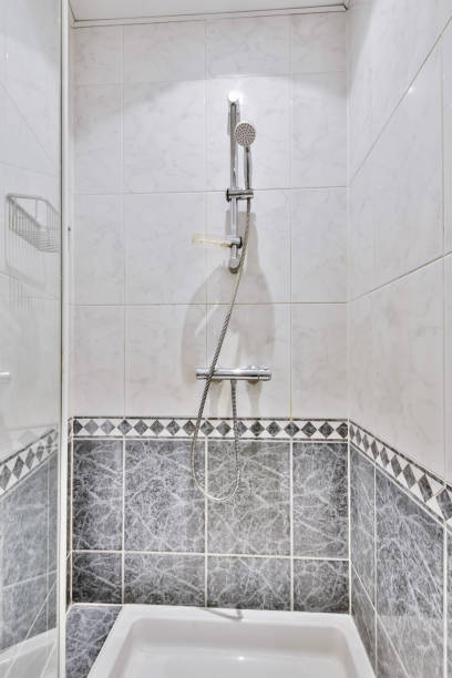 istock A light shower cabin with a blue tiled floor 1374867232