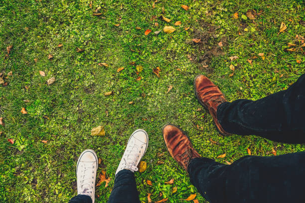 View of feet on a lawn.