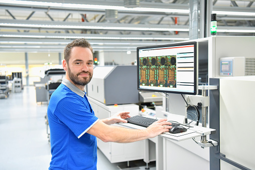 production of electronic components in a modern factory - engineer at the workplace